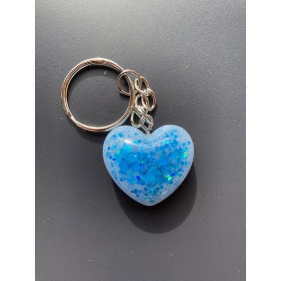 Porte-clé coeur, blanc à paillettes bleues.