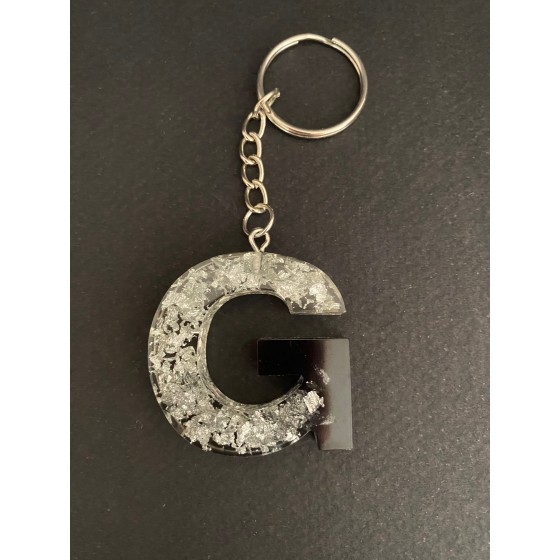 Porte-clé lettre "G" noir / feuilles argentées